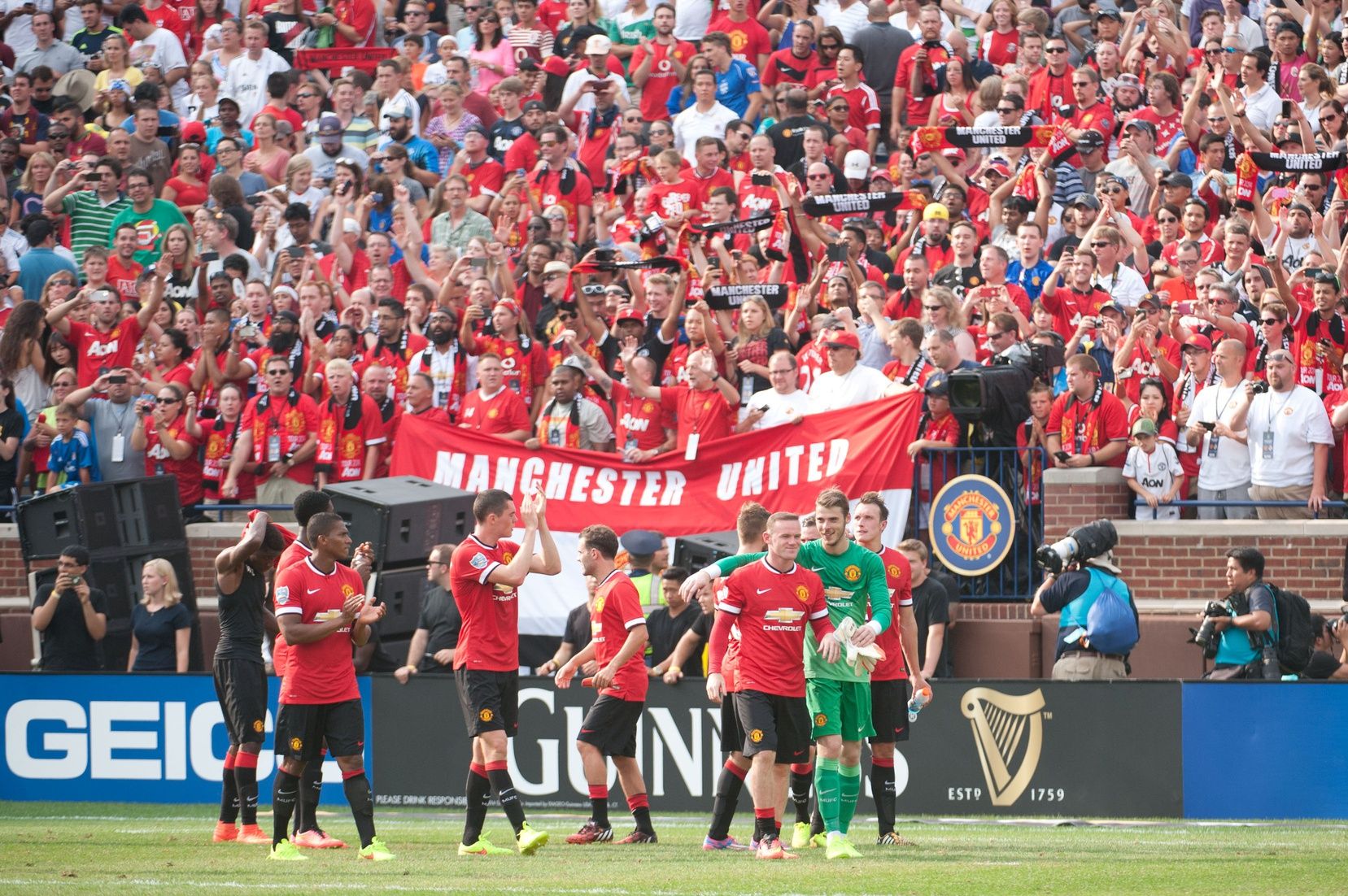 Manchester United fans cheer on players during the game against the Real Madrid at Michigan Stadium.