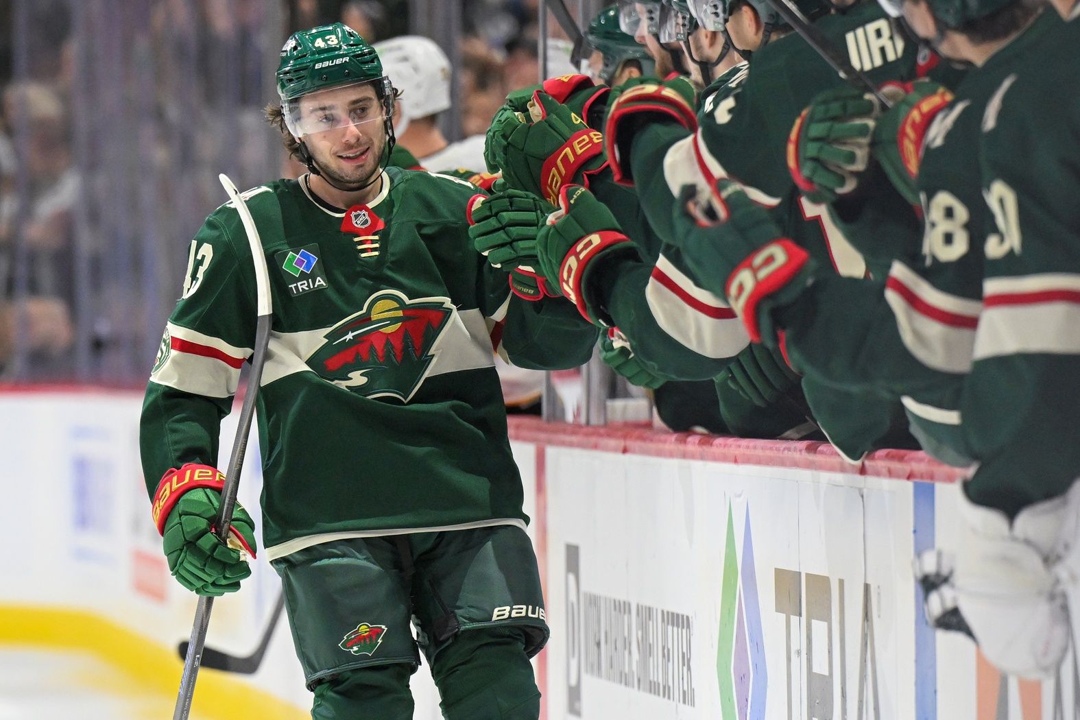 Minnesota Wild defensemen Quinn Hughes (43) celebrates after scoring a goal against the Boston Bruins during the third period at Grand Casino Arena.