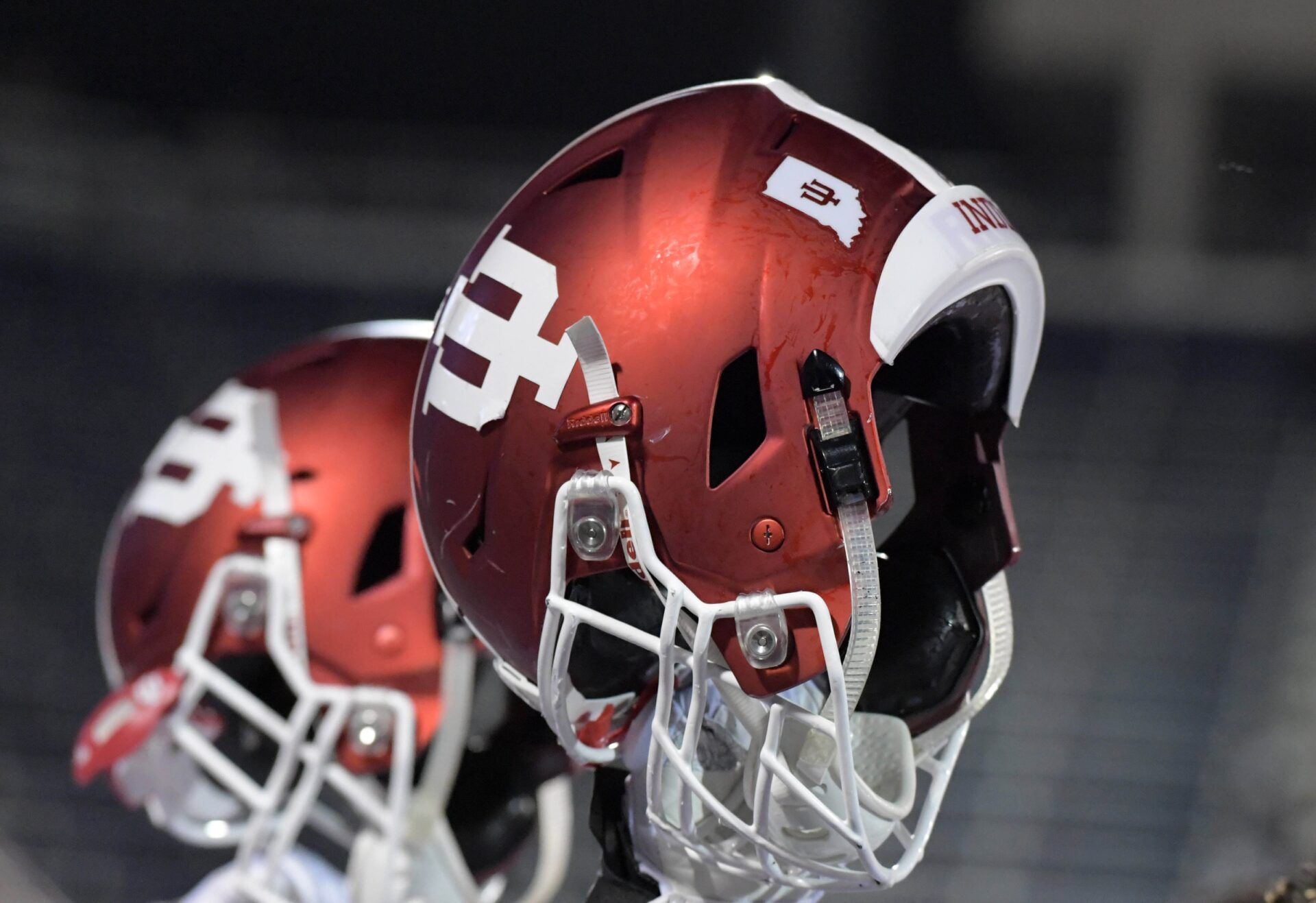 Indiana Hoosiers players hoist their helmets after the game against the FIU Golden Panthers at Riccardo Silva Stadium. Indiana defeated FIU 38-28.
