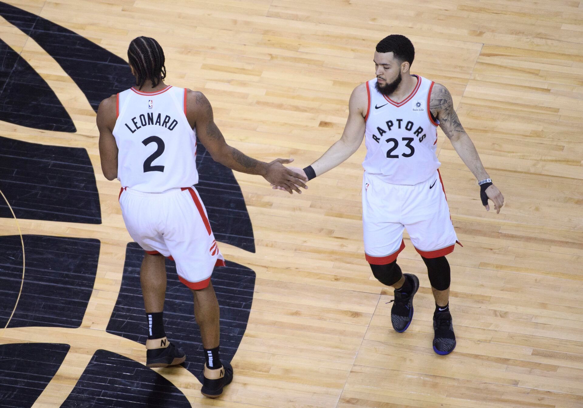 Toronto Raptors forward Kawhi Leonard (2) celebrates with Raptors guard Fred VanVleet (23) during the fourth quarter in game four of the Eastern conference finals of the 2019 NBA Playoffs at Scotiabank Arena.