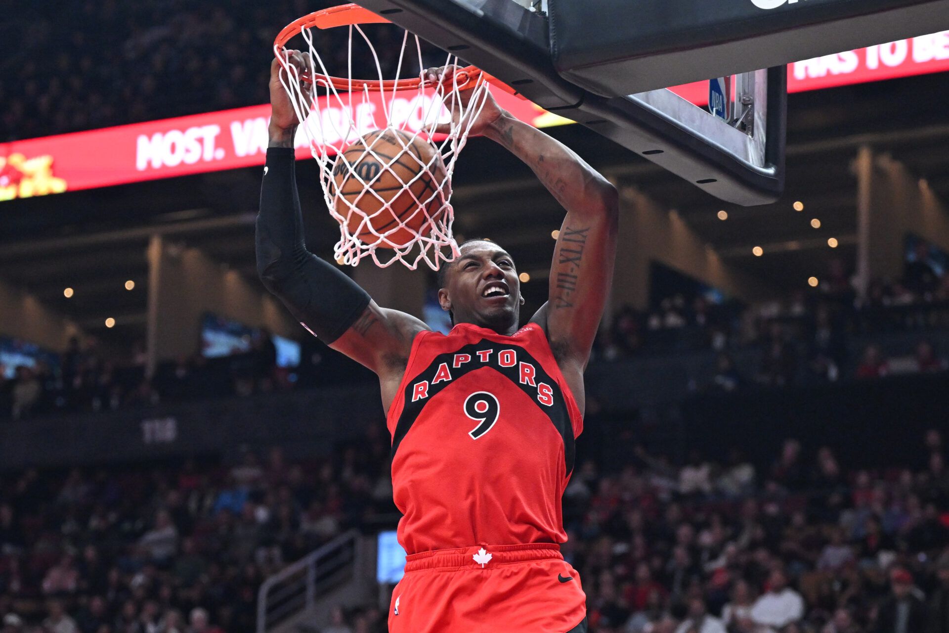 Toronto Raptors forward RJ Barrett (9) dunks for a basket against the Brooklyn Nets in the second half at Scotiabank Arena.