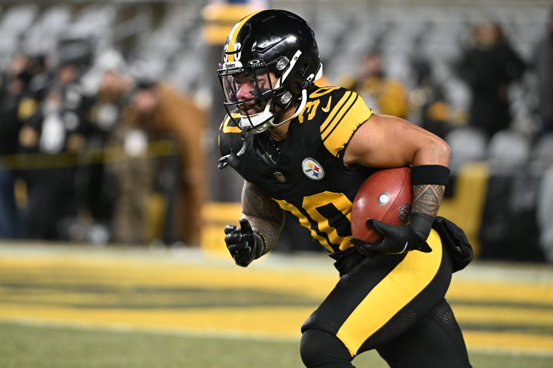 Pittsburgh Steelers running back Jaylen Warren (30) warms up before the game against the Miami Dolphins at Acrisure Stadium.