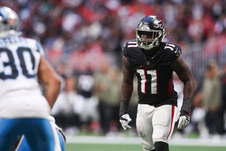 Atlanta Falcons edge Jalon Walker (11) prepares for the start of a play in the fourth quarter against the Carolina Panthers at Mercedes-Benz Stadium.