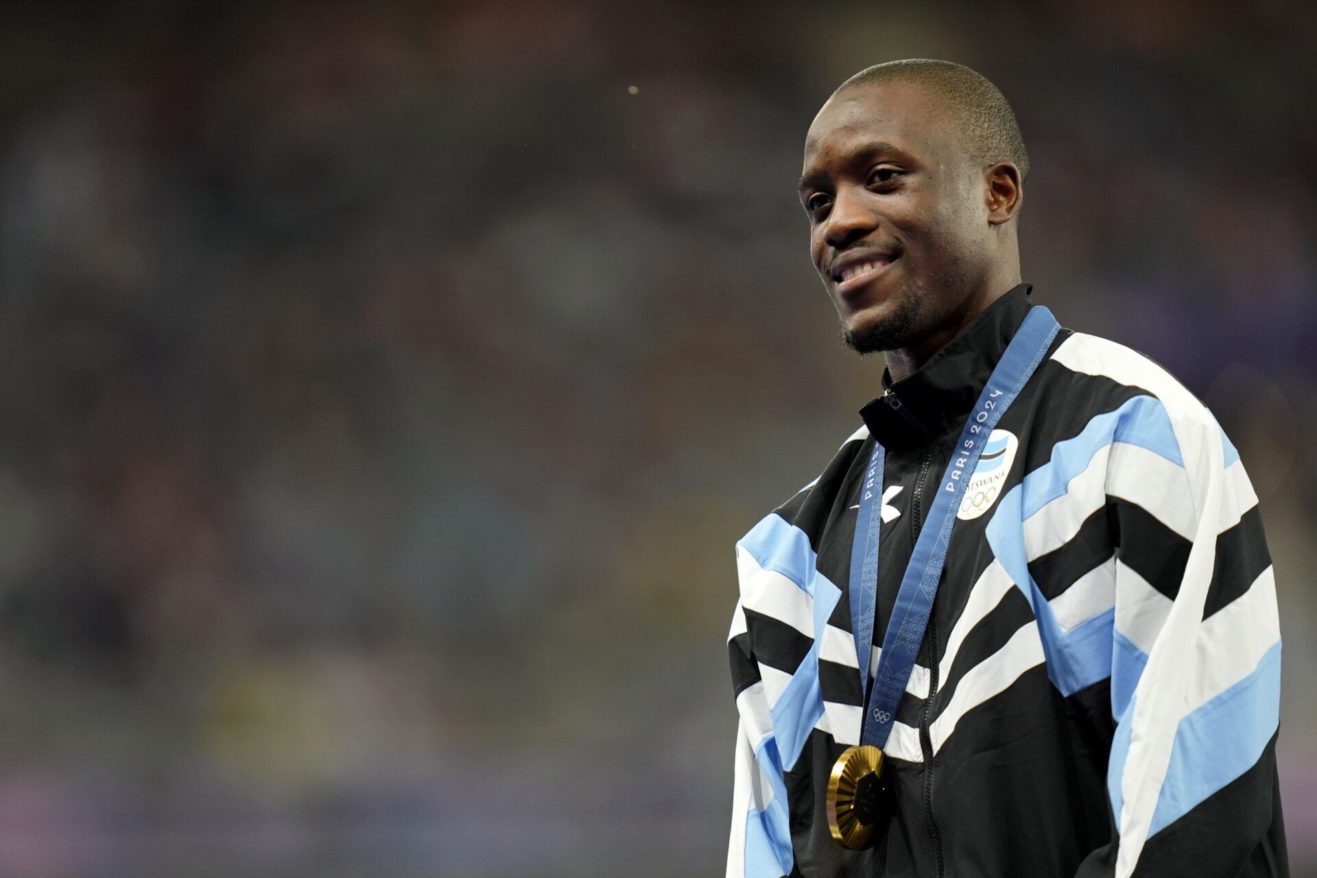 Letsile Tebogo (BOT) celebrates his gold medal in the mens 200m during the Paris 2024 Olympic Summer Games at Stade de France.