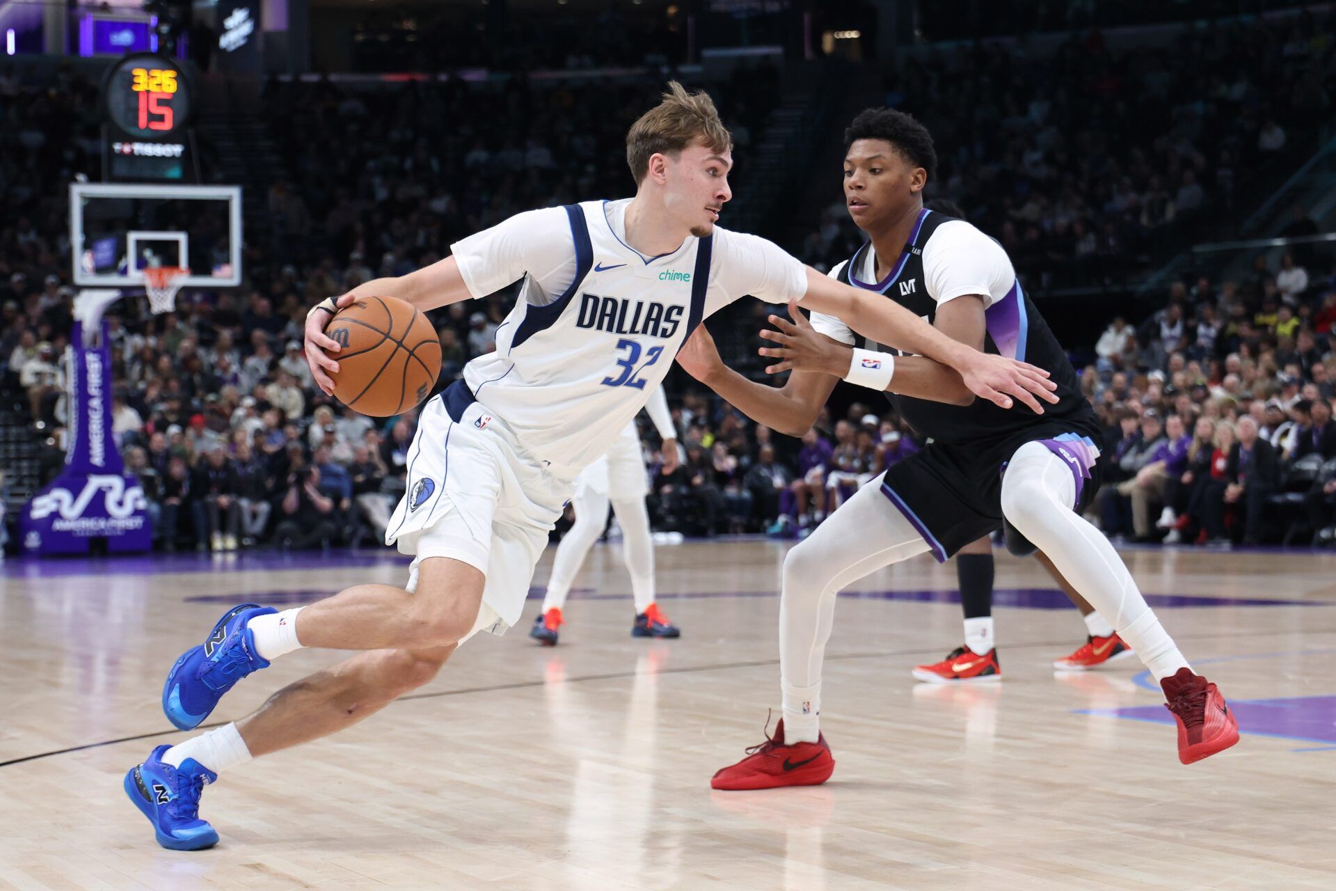 Dallas Mavericks forward Cooper Flagg (32) drives to the basket against Utah Jazz guard Ace Bailey (19) during the second quarter at Delta Center.