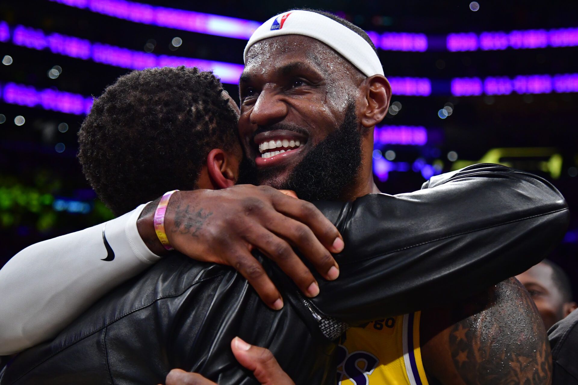 Los Angeles Lakers forward LeBron James (6) hugs agent Rich Paul after breaking the all-time scoring record in the third quarter against the Oklahoma City Thunder at Crypto.com Arena.