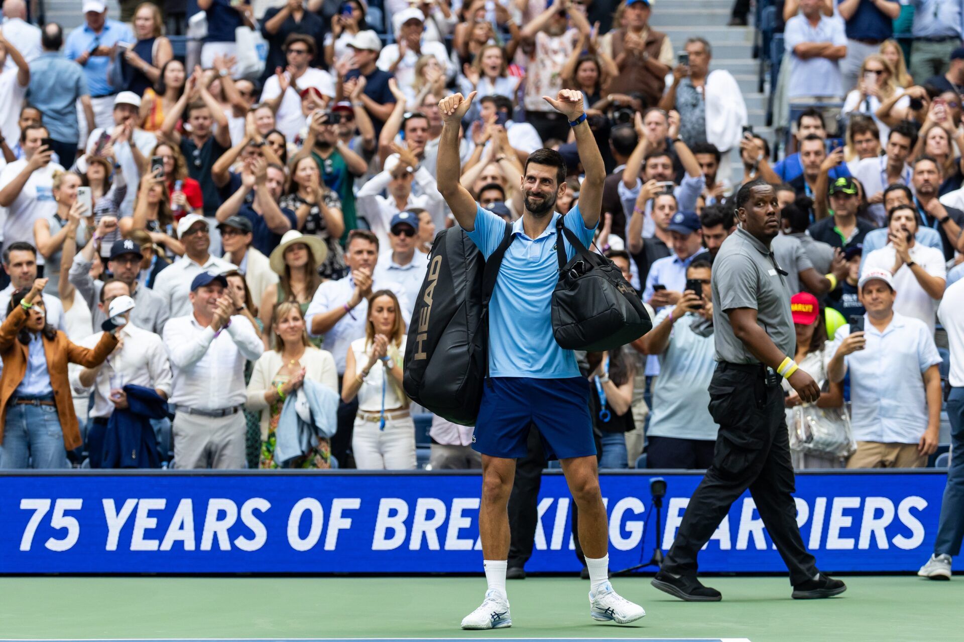 Novak Djokovic of Serbia wave to the audience after his match against Carlos Alcaraz of Spain in the semifinal of the mens singles at the US Open at Arthur Ashe Stadium in Billie Jean King National Tennis Center.
