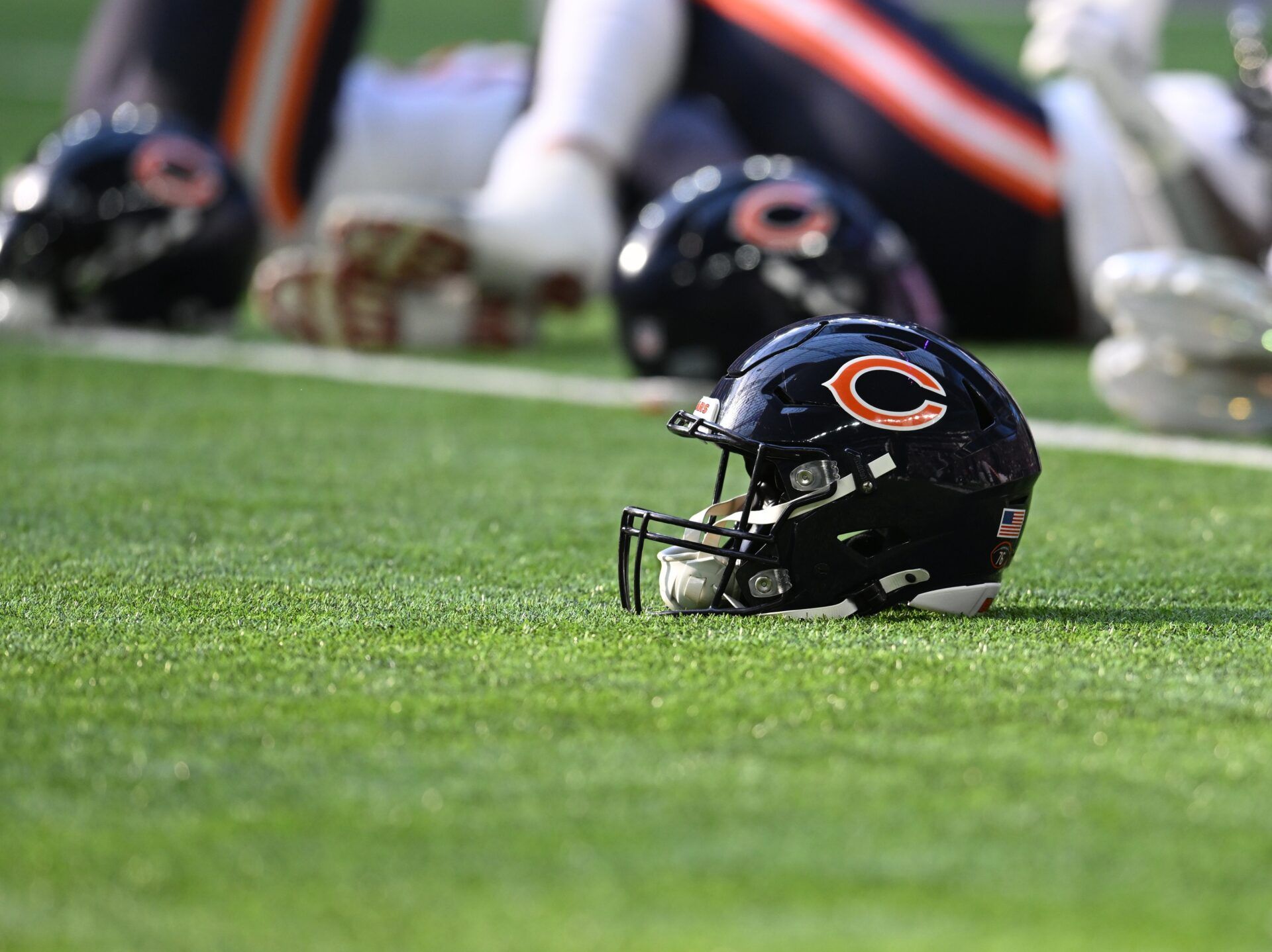 A Chicago Bears helmet sits on the field prior to a game against the Minnesota Vikings at U.S. Bank Stadium.