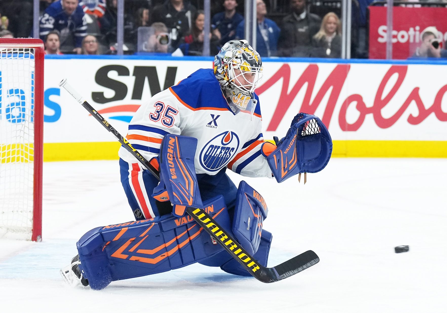 Edmonton Oilers goaltender Tristan Jarry (35) tries to stop the puck against the Toronto Maple Leafs during the first period at Scotiabank Arena.