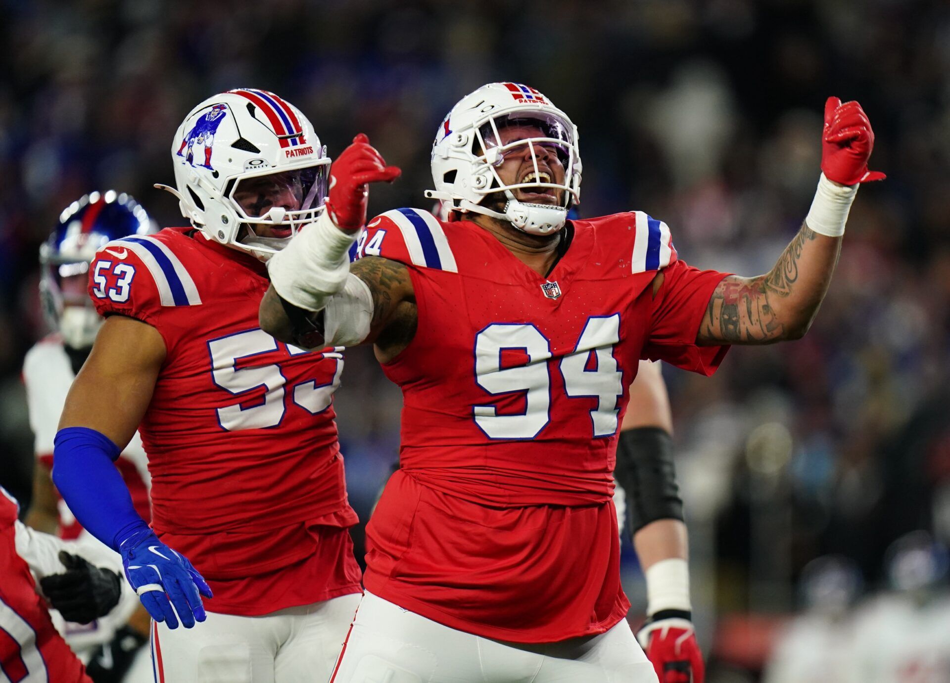 New England Patriots defensive tackle Cory Durden (94) celebrates after a play during the fourth quarter against the New York Giants at Gillette Stadium.