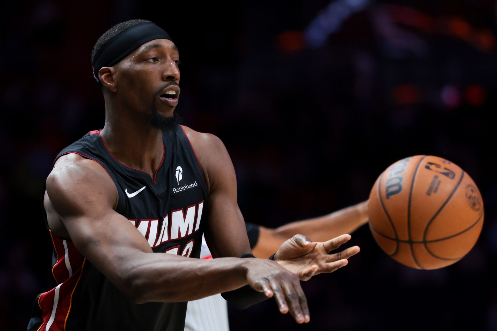 Miami Heat center Bam Adebayo (13) passes the basketball to a teammate against the Toronto Raptors during the fourth quarter at Kaseya Center.