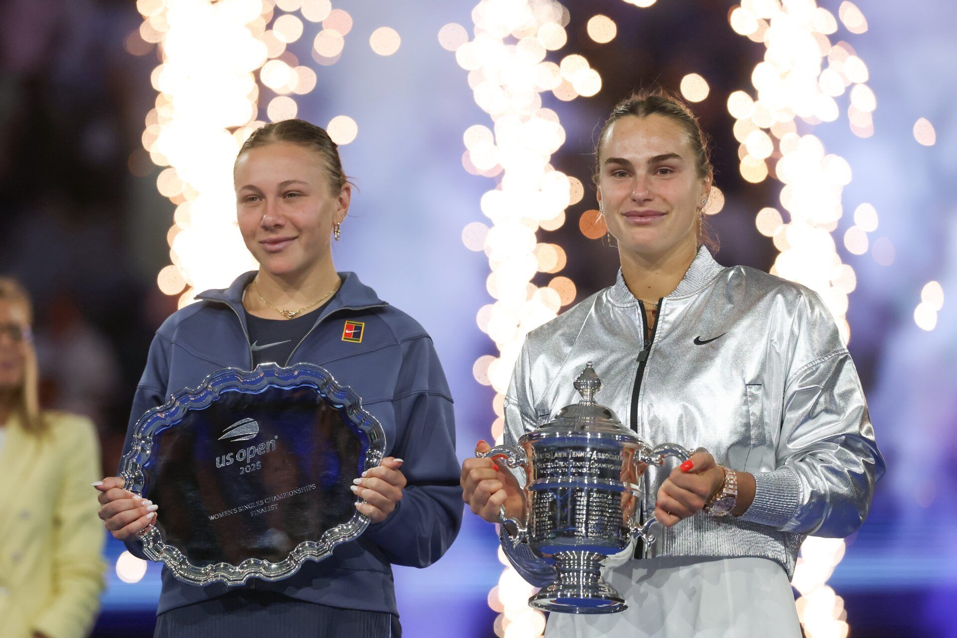 Amanda Anisimova (USA) and Aryna Sabalenka pose for a photo with their trophies after the women's singles final of the 2025 US Open tennis championships at Billie Jean King National Tennis Center.