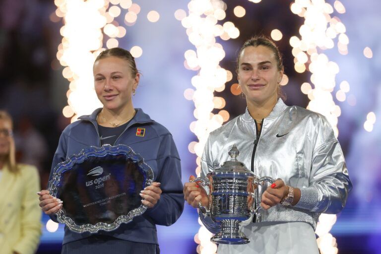 Amanda Anisimova (USA) and Aryna Sabalenka pose for a photo with their trophies after the women's singles final of the 2025 US Open tennis championships at Billie Jean King National Tennis Center.
