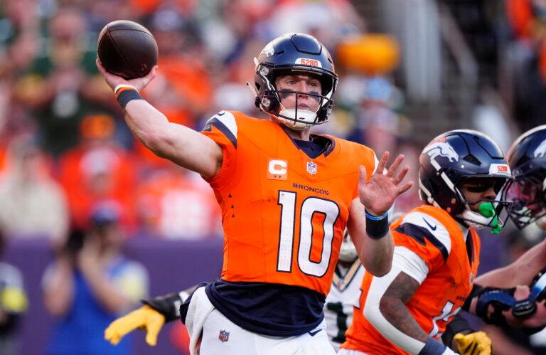 Denver Broncos quarterback Bo Nix (10) throws downfield during the second quarter against the Green Bay Packers at Empower Field at Mile High.