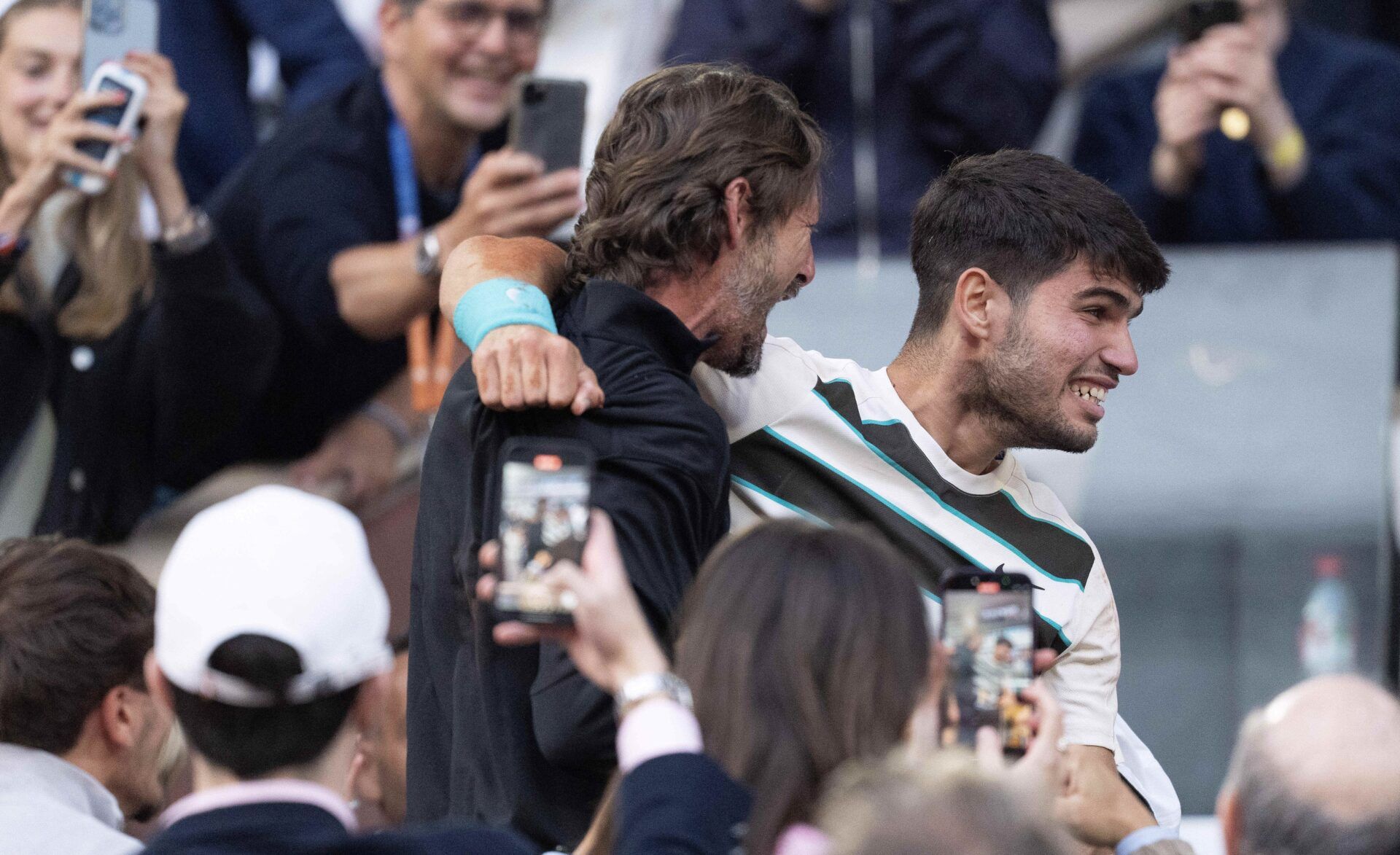 Carlos Alcaraz of Spain celebrates with his coach, Juan Carlos Ferrero after winning the men’s singles final against Jannik Sinner of Italy on day 15 at Roland Garros Stadium.