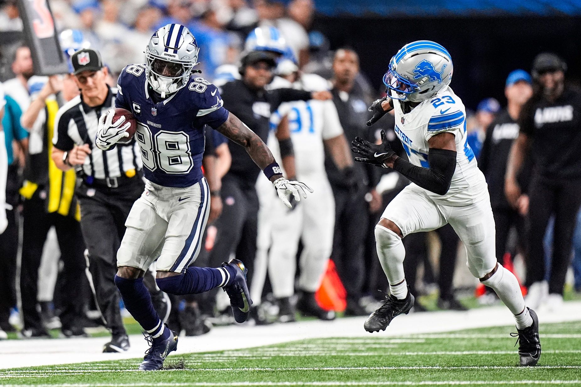 Dallas Cowboys wide receiver CeeDee Lamb makes a catch against Detroit Lions cornerback Rock Ya-Sin during the first half at Ford Field in Detroit on Thursday, Dec. 4, 2025.