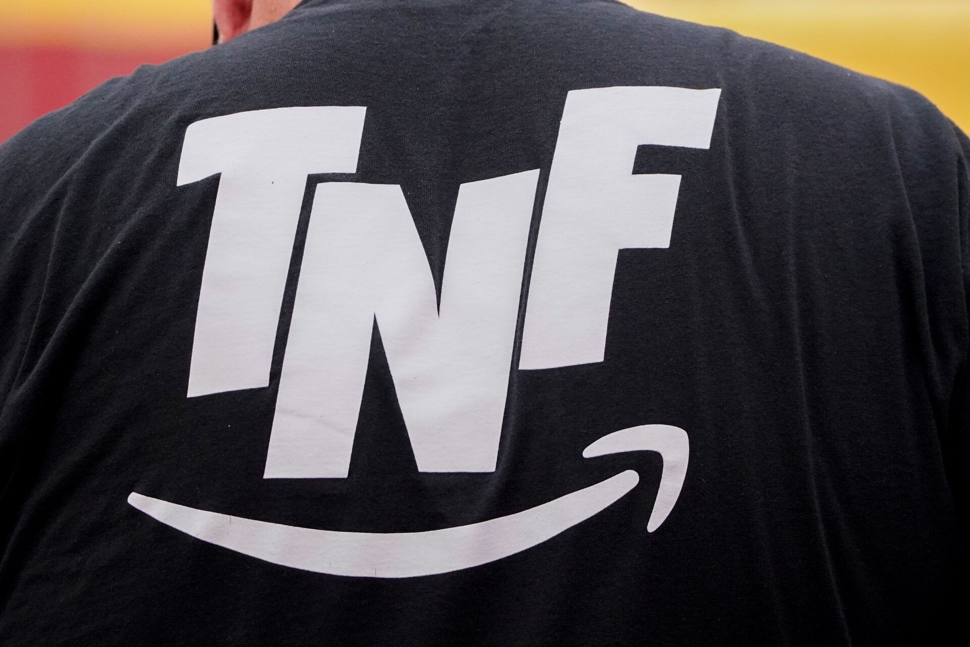A general view of the Amazon Thursday Night Football logo on a worker’s shirt prior to a game between the Kansas City Chiefs and Denver Broncos at GEHA Field at Arrowhead Stadium.