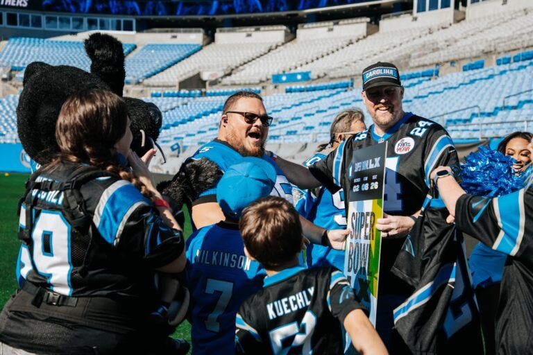 Nov. 3, 2025; Carolina Panthers Fan of the Year, Lawrence Wilkinson, celebrates with family and friends during announcement at Bank of America Stadium. Image Courtesy: Carolina Panthers