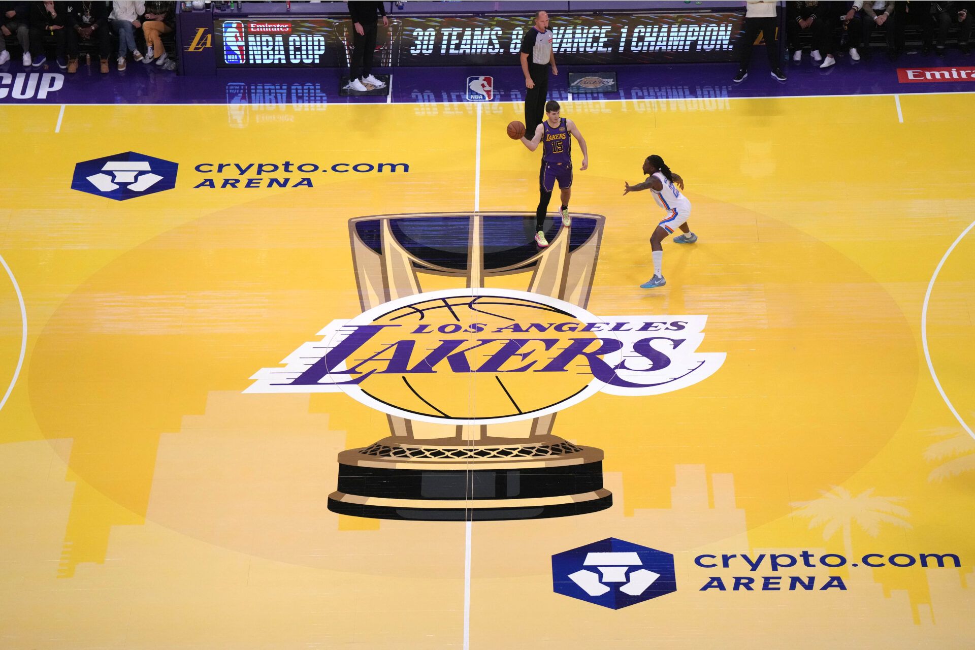 A general overall view as Los Angeles Lakers guard Austin Reaves (15) passes the ball against Oklahoma City Thunder guard Cason Wallace (22) in the first half of a NBA Cup game at Crypto.com Arena.