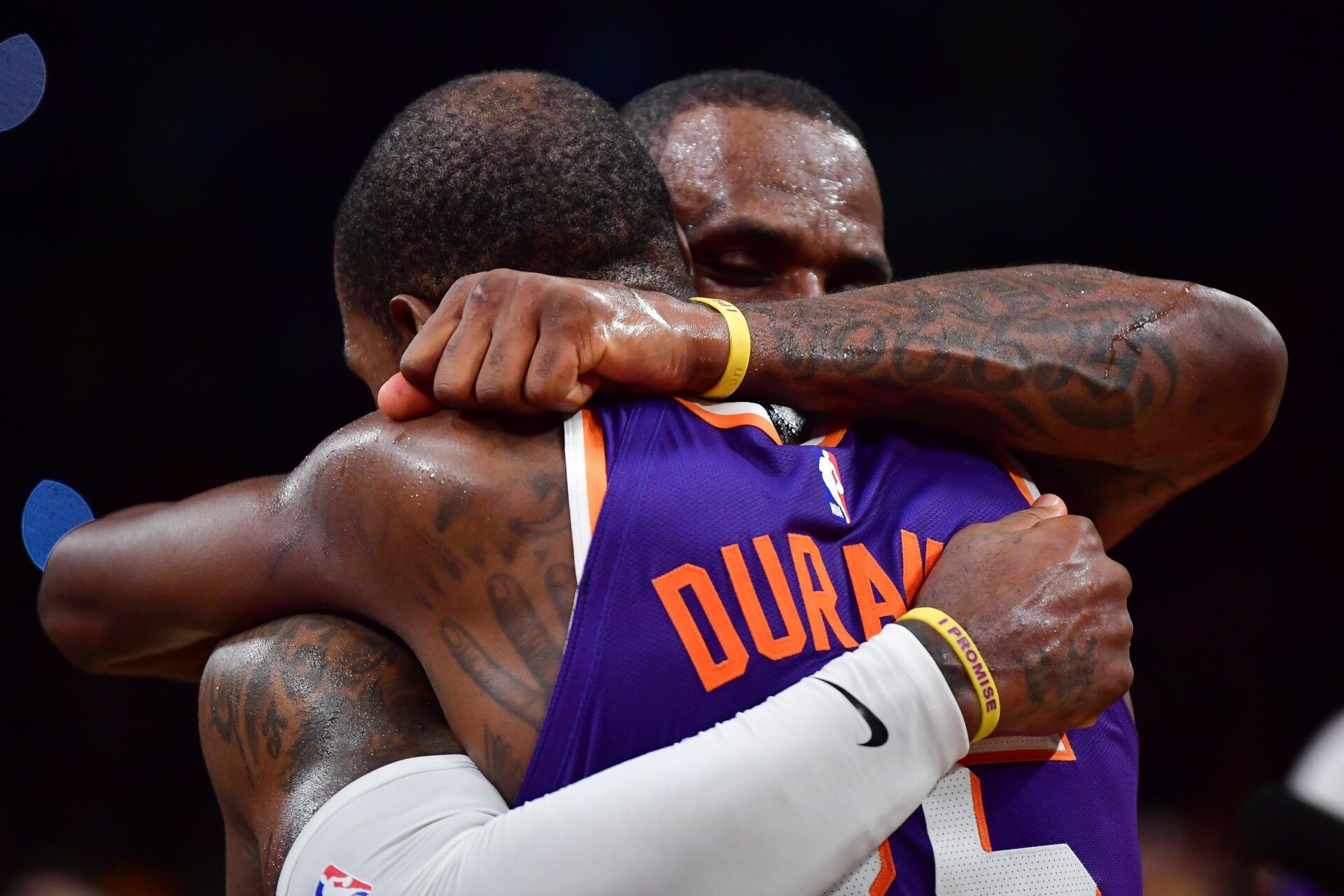 Phoenix Suns forward Kevin Durant (35) meets with Los Angeles Lakers forward LeBron James (23) following the game at Crypto.com Arena.