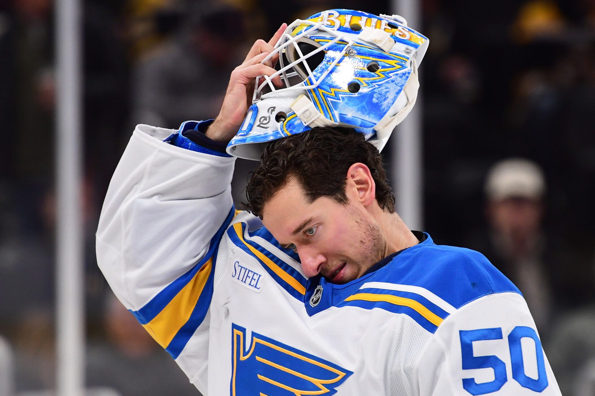 St. Louis Blues goaltender Jordan Binnington (50) slips on his goalie mask during the third period against the Boston Bruins at TD Garden.