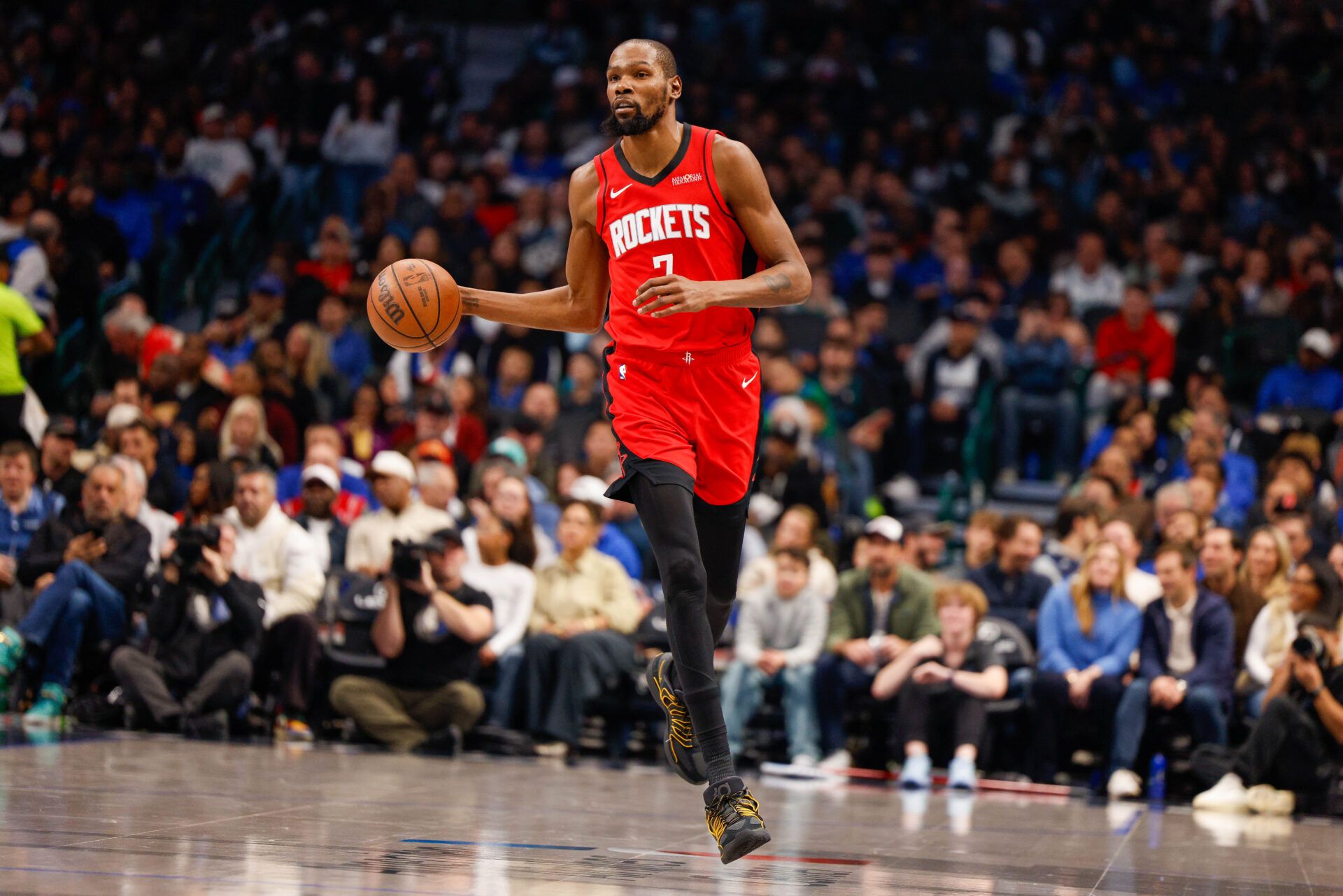 Houston Rockets forward Kevin Durant (7) brings the ball up the court during the first quarter against the Dallas Mavericks at American Airlines Center.