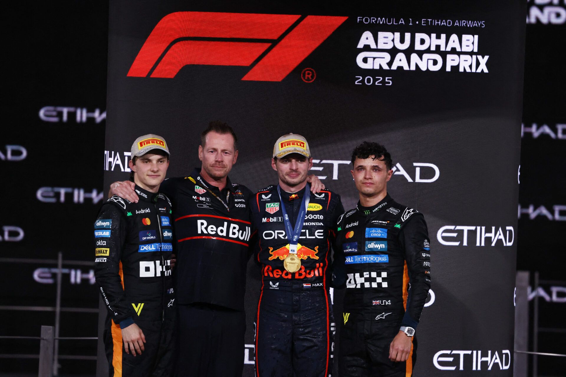 Formula One F1 - Abu Dhabi Grand Prix - Yas Marina Circuit, Abu Dhabi, United Arab Emirates - December 7, 2025 Red Bull's Max Verstappen celebrates on the podium after winning the Abu Dhabi Grand Prix alongside second placed McLaren's Oscar Piastri and third placed 2025 Formula One World Champion McLaren's Lando Norris REUTERS/Amr Alfiky