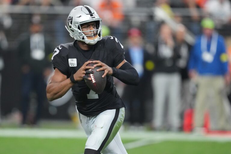 Las Vegas Raiders quarterback Geno Smith (7) stands in the pocket against the Denver Broncos during the second half at Allegiant Stadium.