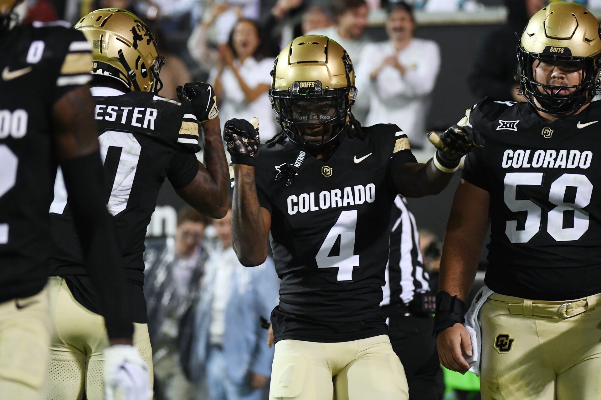 Colorado Buffaloes wide receiver Omarion Miller (4) celebrates with teammates after a touchdown during the first half against the Baylor Bears at Folsom Field.