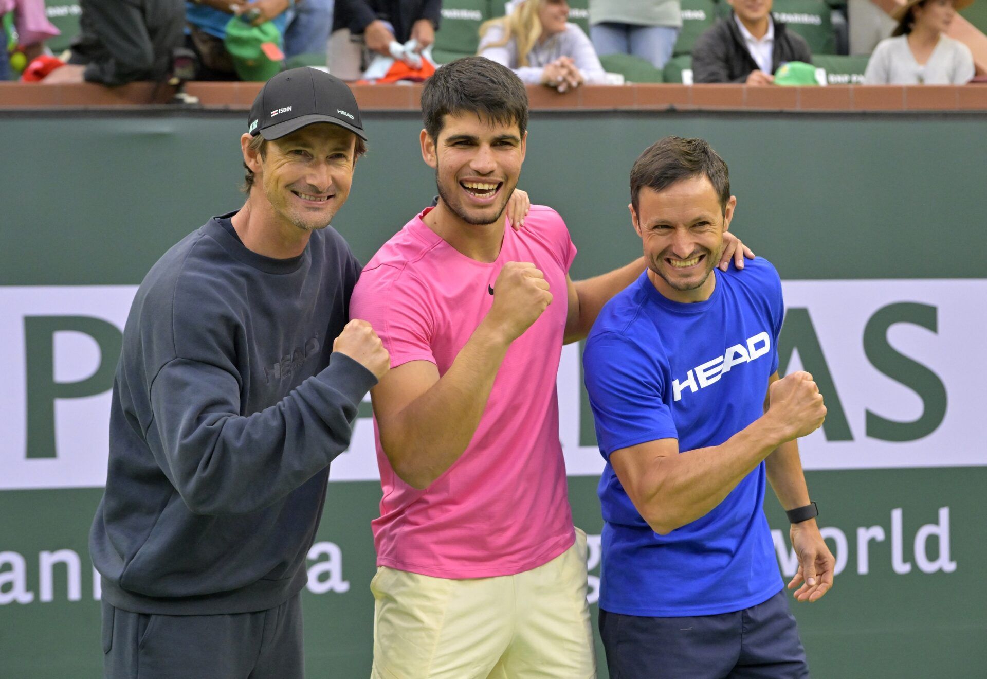 Carlos Alcaraz (ESP) poses with his coaches Juan Carlos Ferrero and Juanjo Moreno after defeating Daniil Medvedev (RUS) in the men’s final of the BNP Paribas Open at the Indian Wells Tennis Garden.