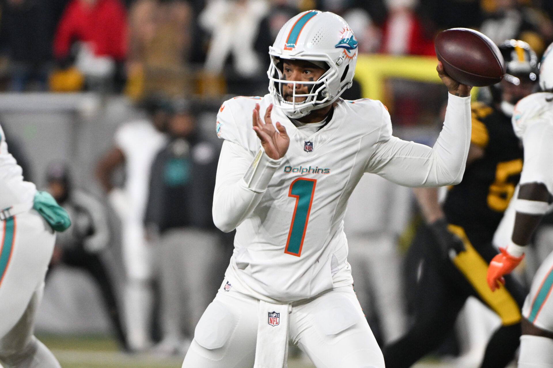 Miami Dolphins quarterback Tua Tagovailoa (1) throws in the first quarter against the Pittsburgh Steelers at Acrisure Stadium.