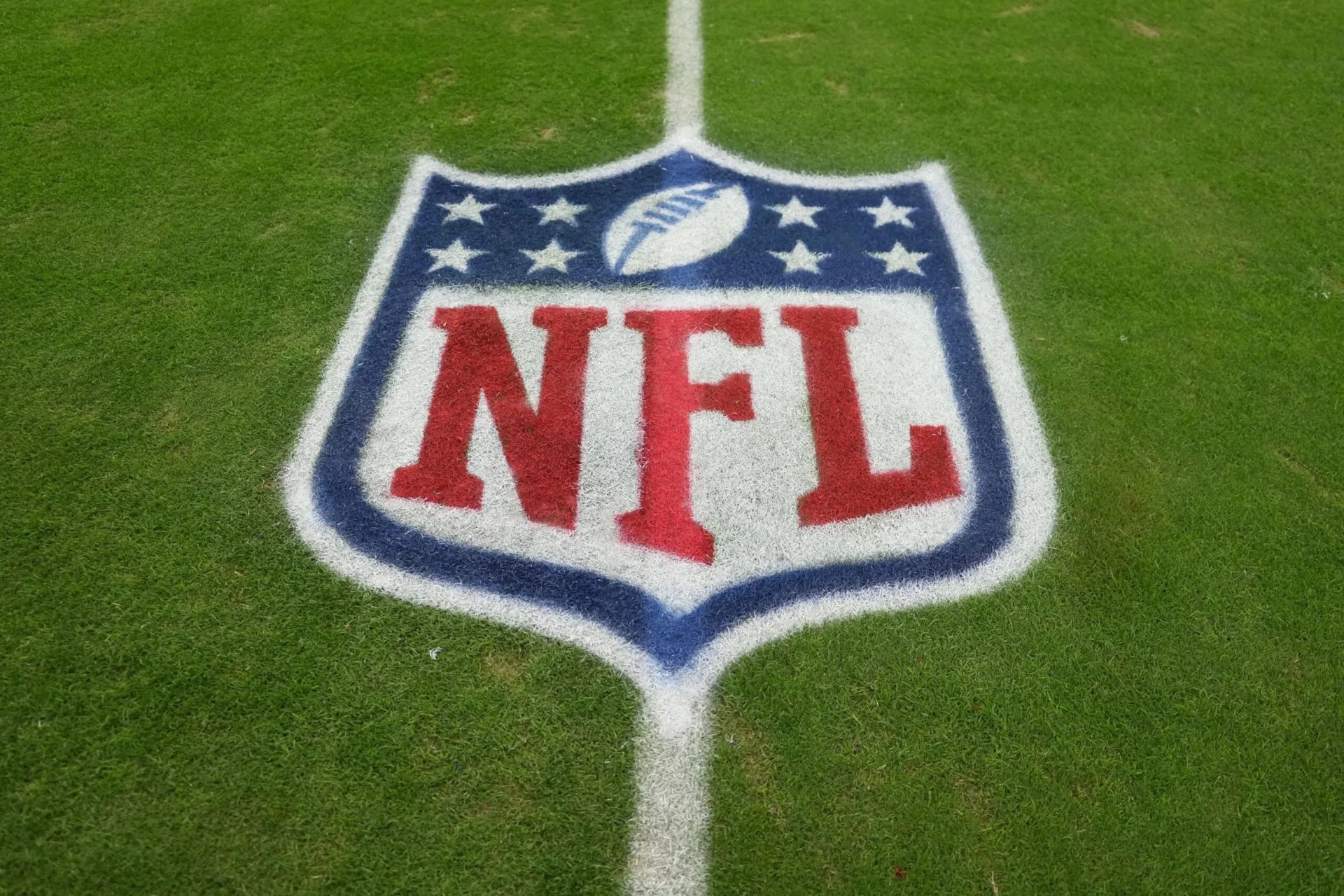The NFL shield logo on the field at Allegiant Stadium.
