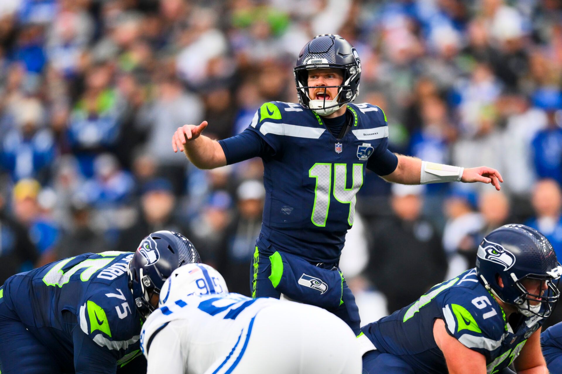 Seattle Seahawks quarterback Sam Darnold (14) audibles over center against the Indianapolis Colts during the third quarter at Lumen Field.
