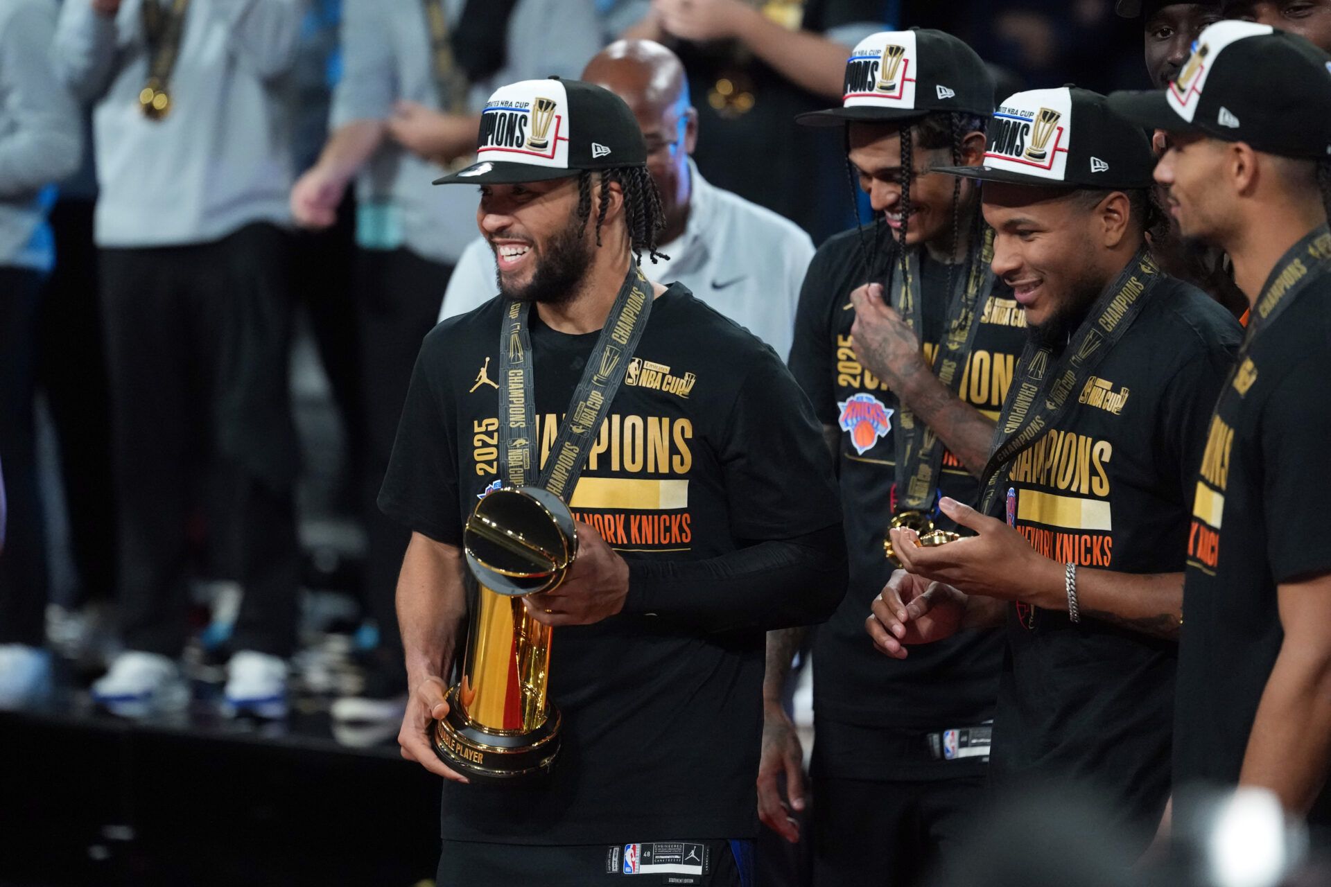 New York Knicks guard Jalen Brunson (11) poses with the most valuable player trophy after victory over the San Antonio Spurs during the Emirates NBA Cup Final at T-Mobile Arena.