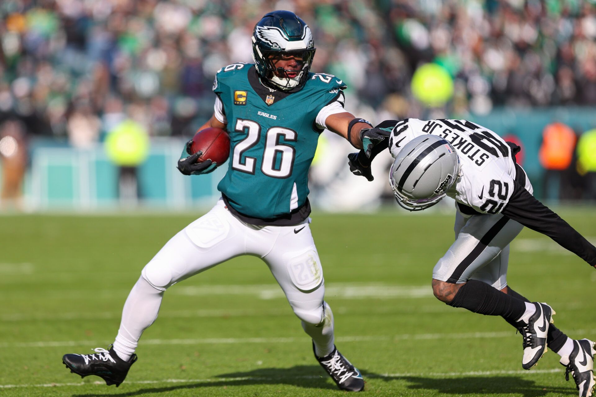 Philadelphia Eagles running back Saquon Barkley (26) runs the ball against Las Vegas Raiders cornerback Eric Stokes (22) during the first quarter at Lincoln Financial Field.