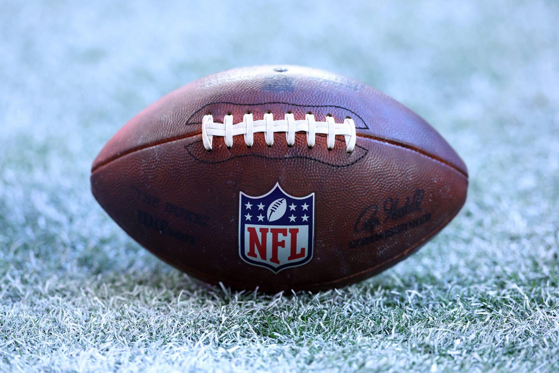 Detailed view of the NFL shield logo on an official Wilson football during the Arizona Cardinals game against the Los Angeles Rams at State Farm Stadium.