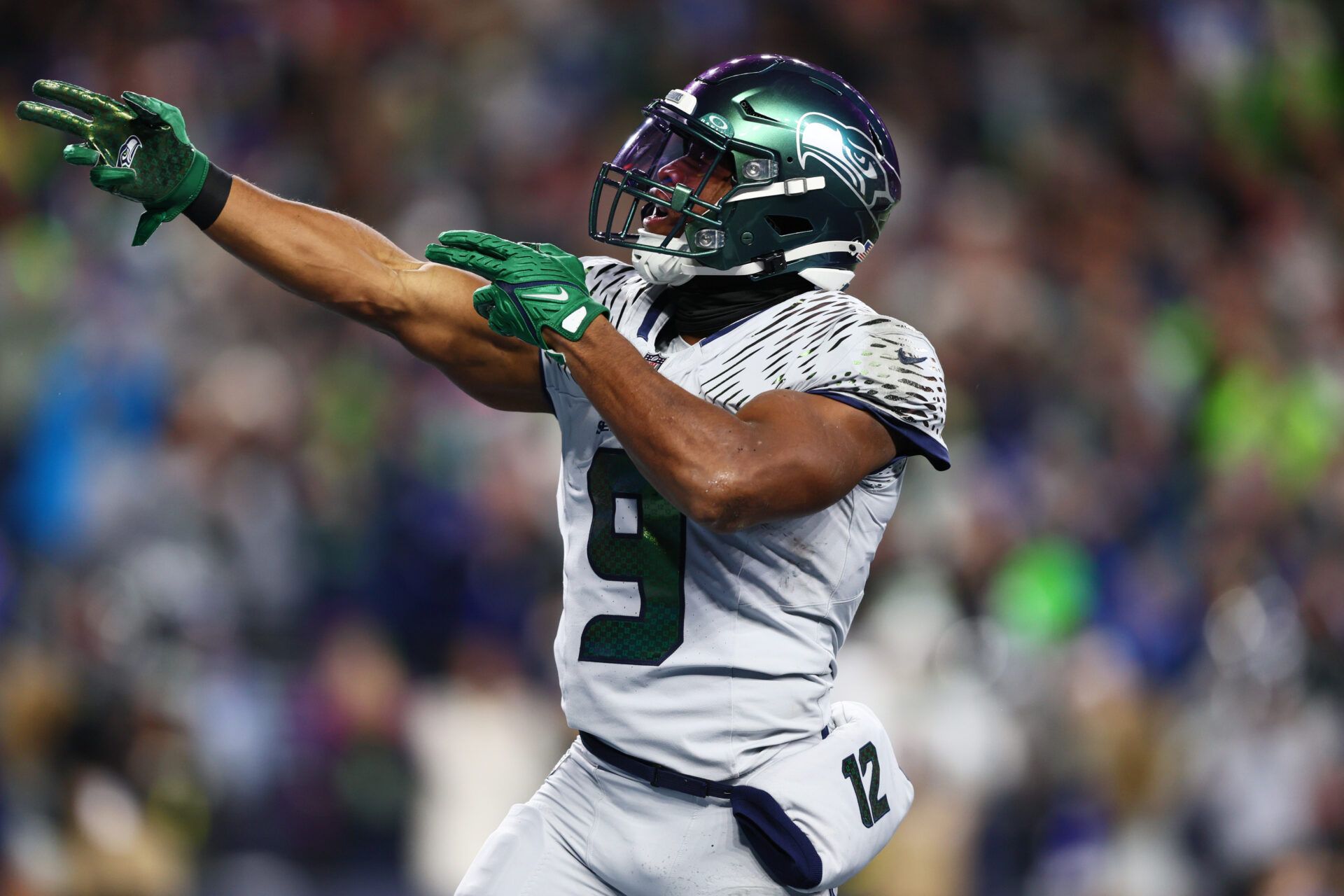 Seattle Seahawks running back Kenneth Walker III (9) reacts after a first down against the Los Angeles Rams in the first half at Lumen Field.