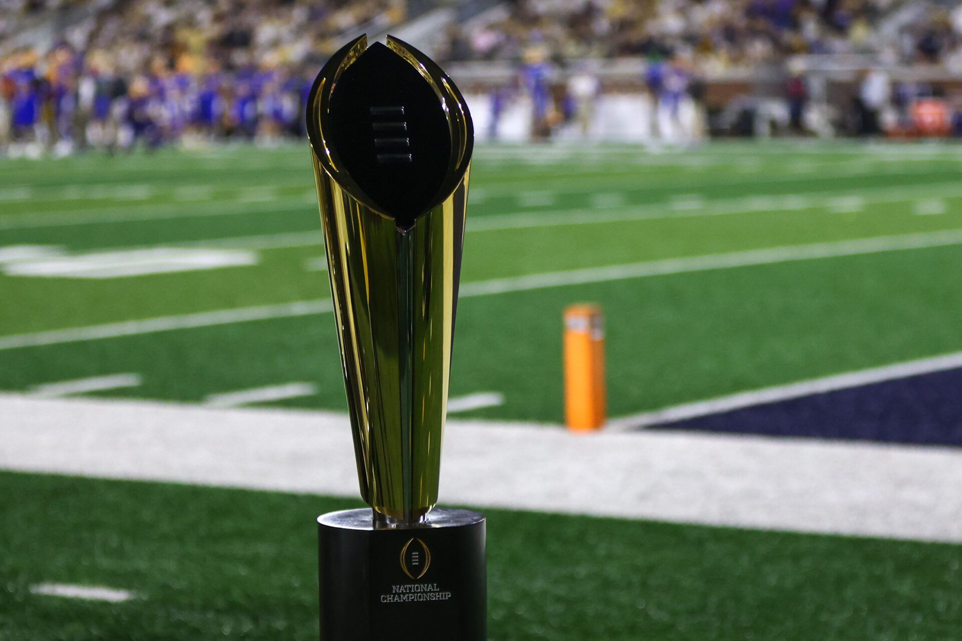 A view of the college football playoff national championship trophy on the sidelines of a game between the Georgia Tech Yellow Jackets and Pittsburgh Panthers in the fourth quarter at Bobby Dodd Stadium at Hyundai Field.