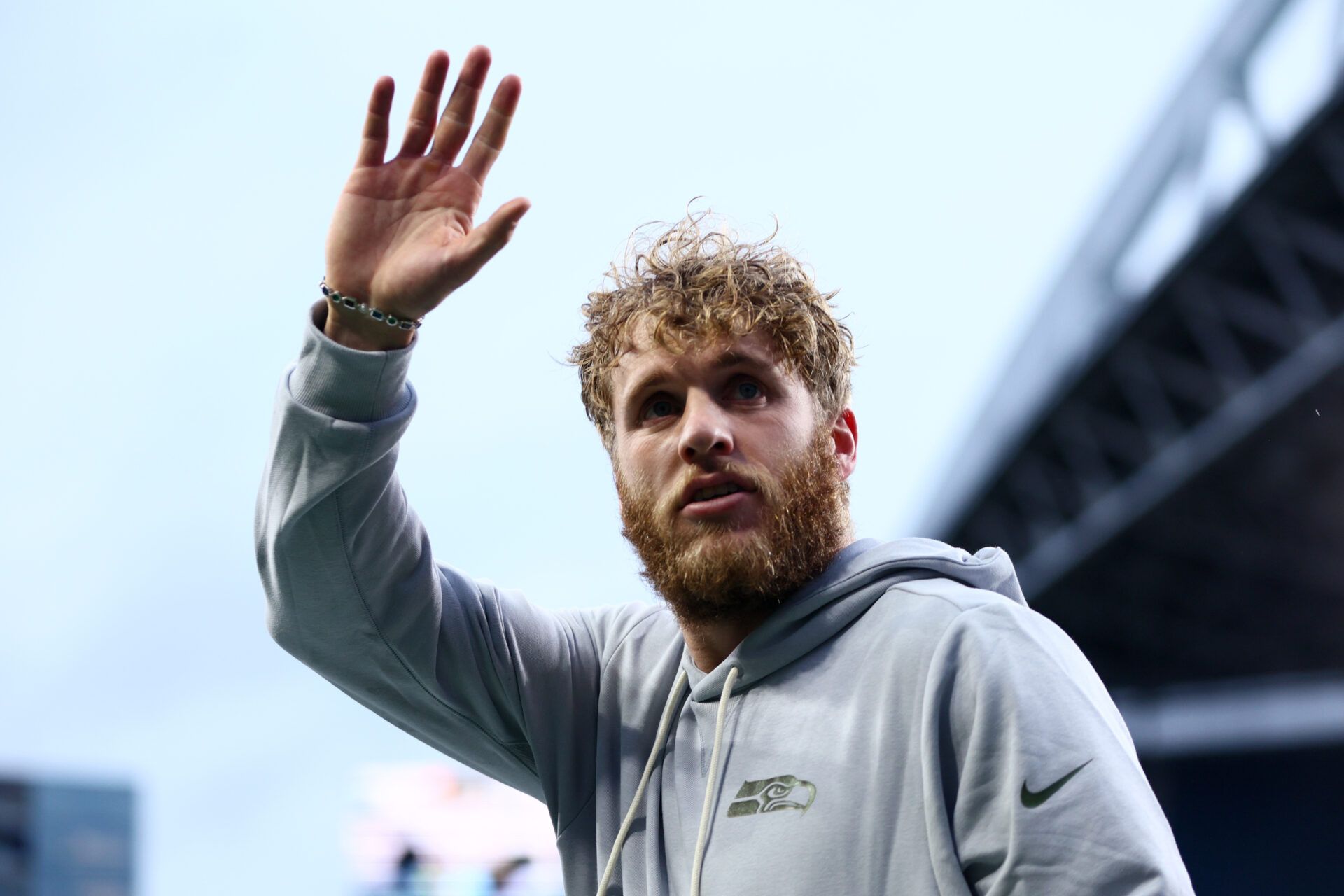 Seattle Seahawks wide receiver Cooper Kupp (10) waves to fans before the game against the Los Angeles Rams at Lumen Field.