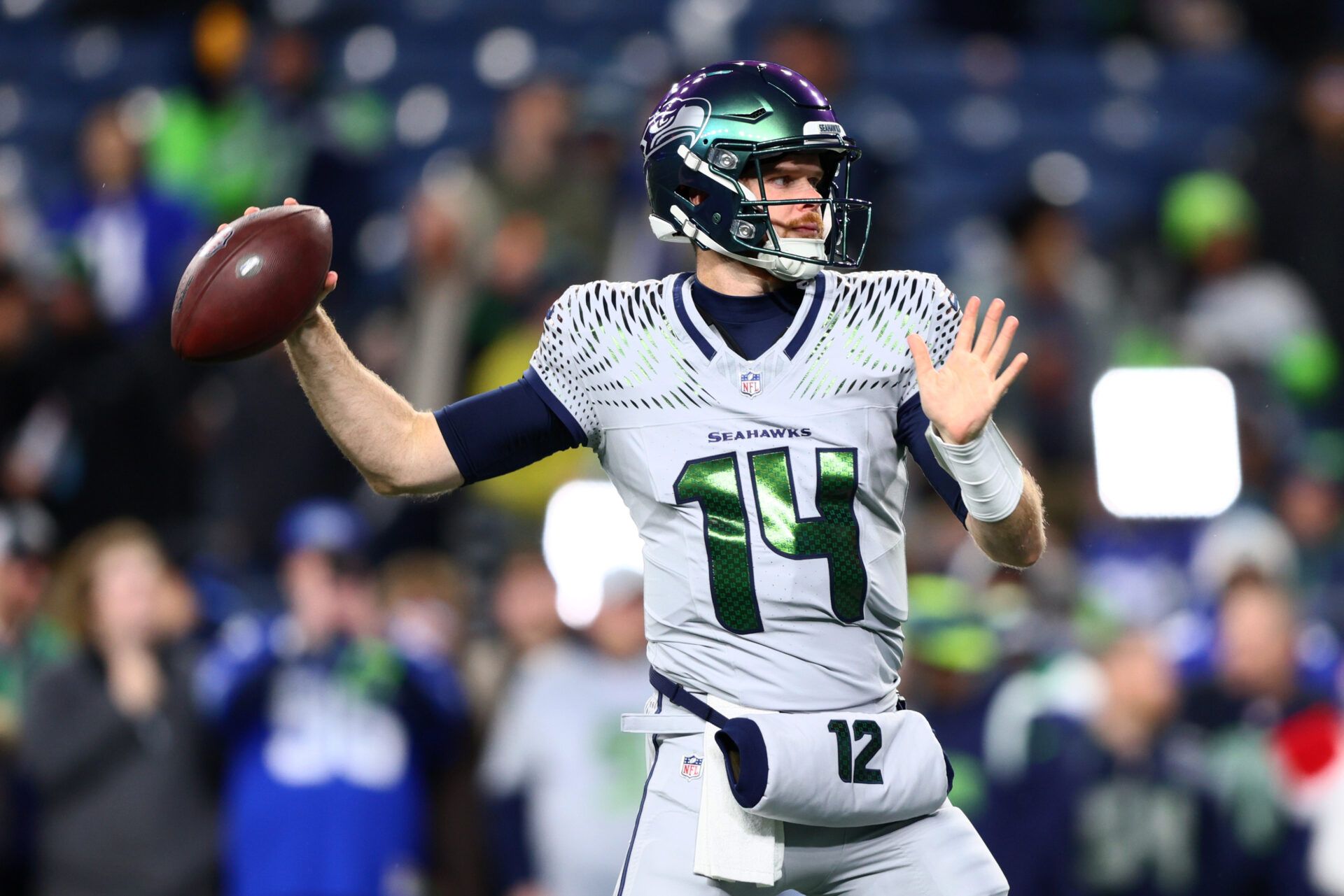 Seattle Seahawks quarterback Sam Darnold (14) warms up before the game against the Los Angeles Rams at Lumen Field.