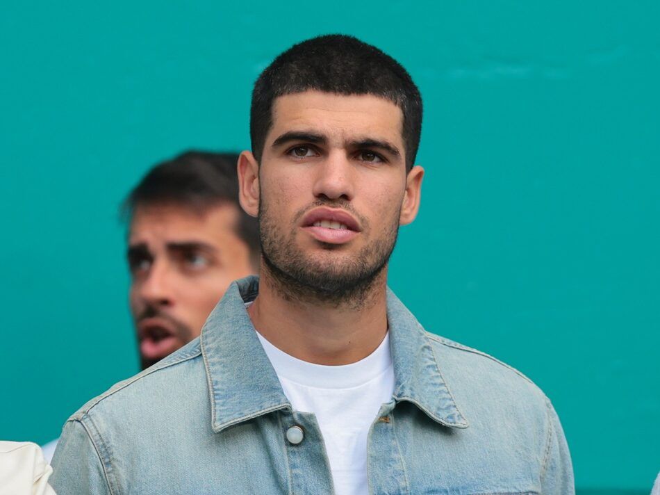 Carlos Alcaraz (right) the current world number one men's tennis player takes in the NFL game between the Miami Dolphins and New Orleans Saints during the second half at Hard Rock Stadium.