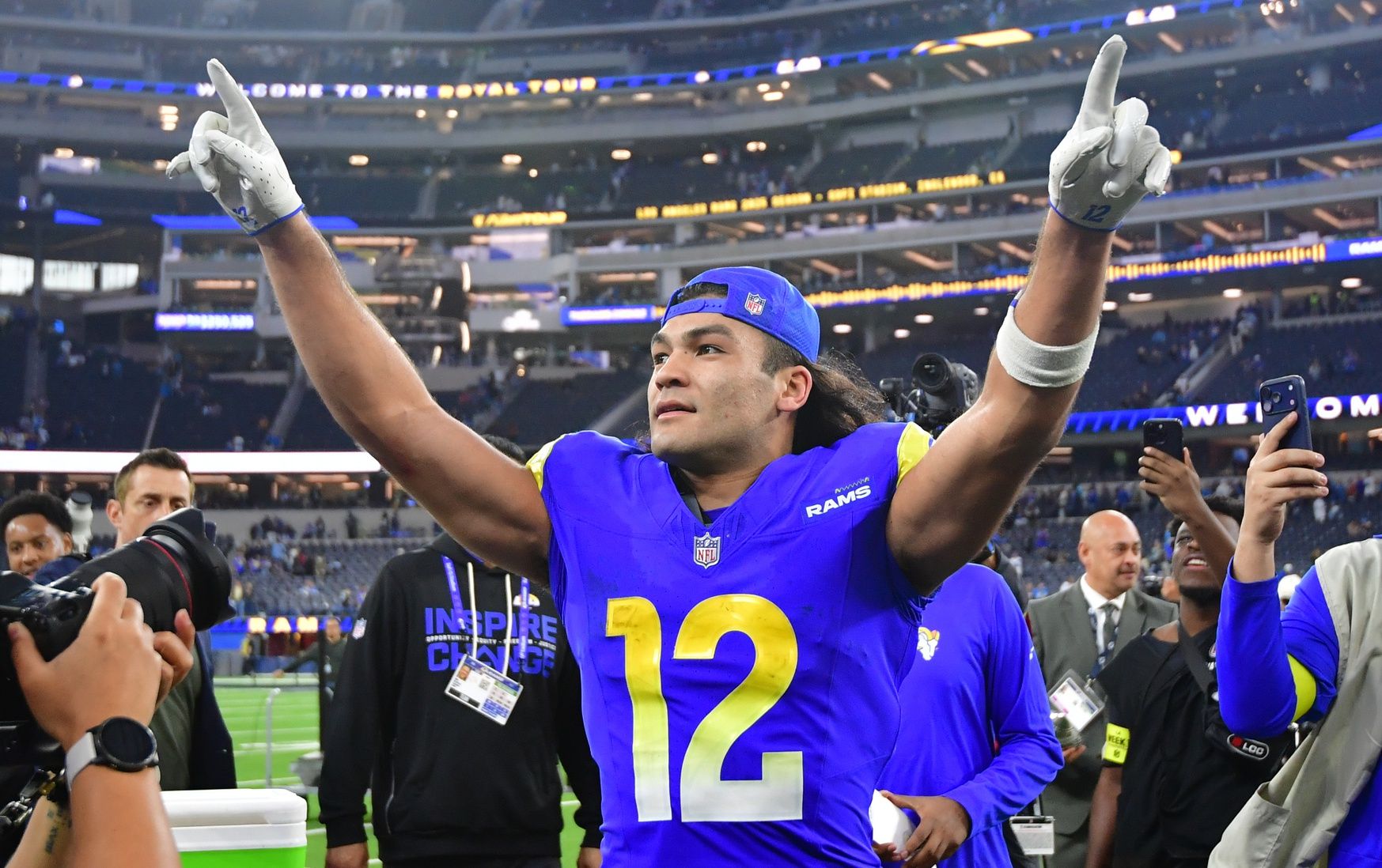 Los Angeles Rams wide receiver Puka Nacua (12) celebrates after defeating the Detroit Lions at SoFi Stadium.