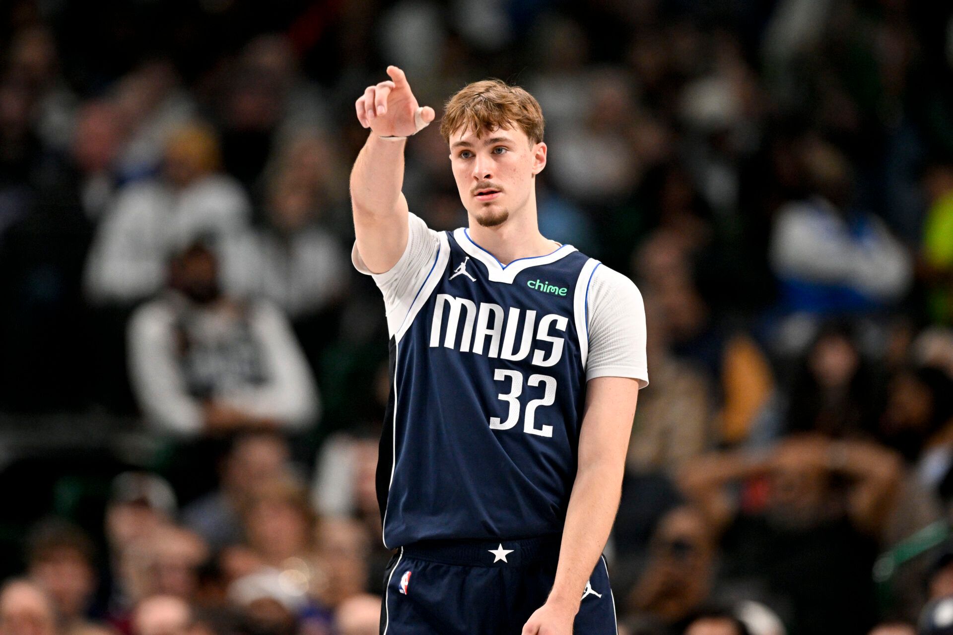 Dallas Mavericks forward Cooper Flagg (32) motions to his teammates during the second quarter against the Detroit Pistons at the American Airlines Center.