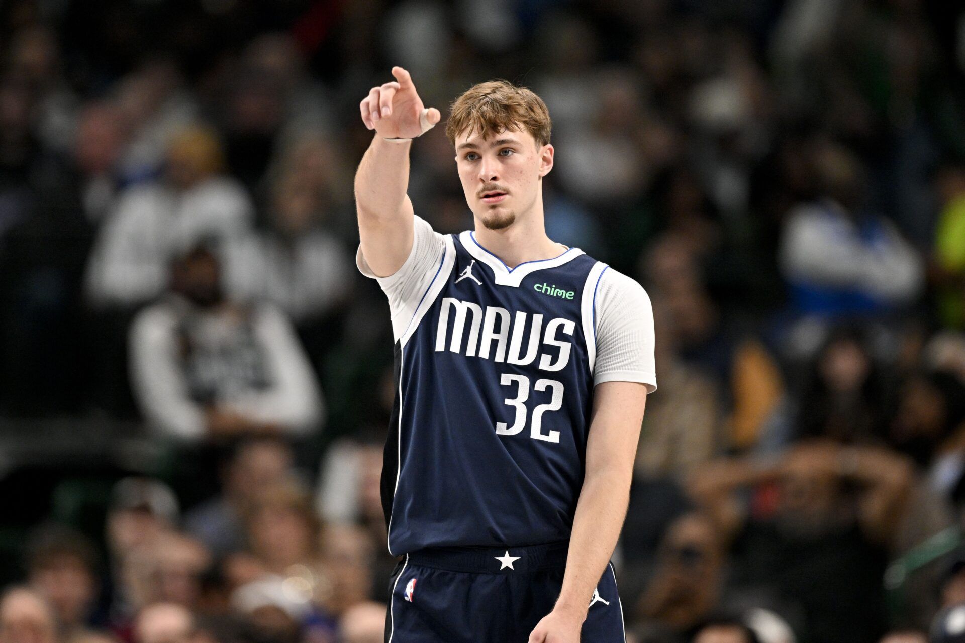Dallas Mavericks forward Cooper Flagg (32) motions to his teammates during the second quarter against the Detroit Pistons at the American Airlines Center.