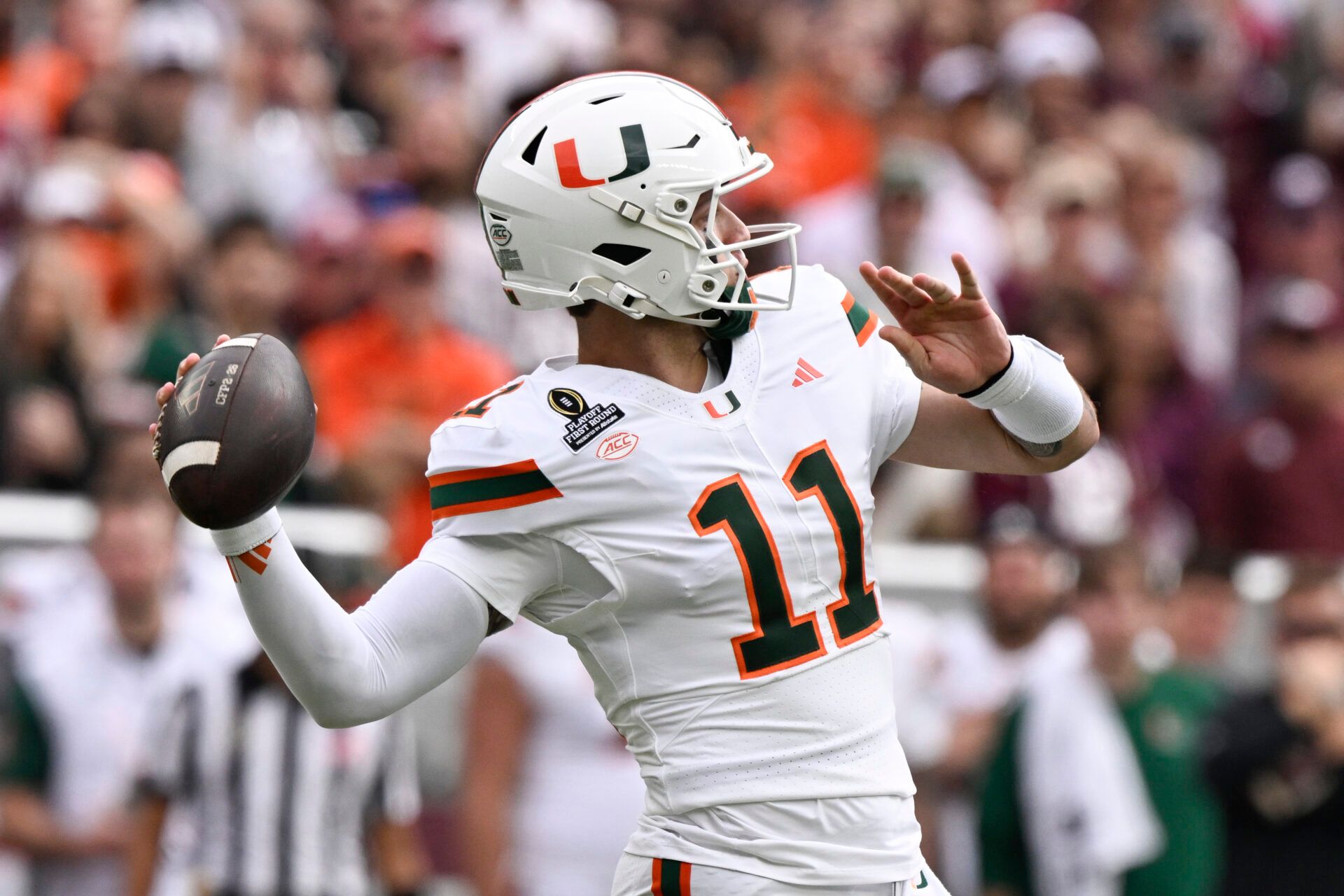 Miami Hurricanes quarterback Carson Beck (11) makes a pass against the Texas A&M Aggies during first half of the first round game of the CFP National Playoff at Kyle Field.