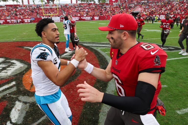 Tampa Bay Buccaneers quarterback Baker Mayfield (6) great Carolina Panthers quarterback Bryce Young (9) after a game at Raymond James Stadium.