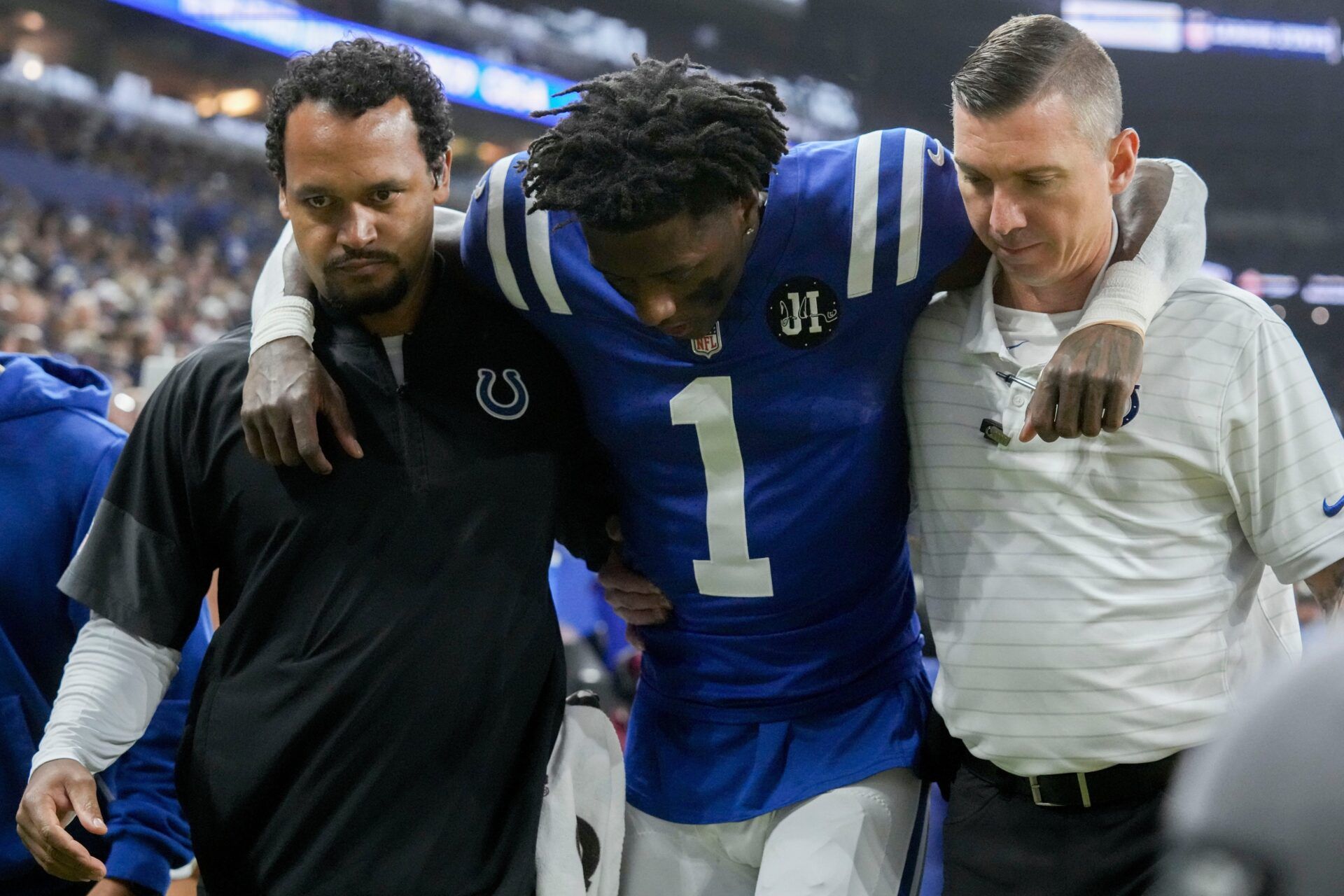 Indianapolis Colts cornerback Sauce Gardner (1) is helped off the field following an injury Sunday, Nov. 30, 2025, during a game against the Houston Texans at Lucas Oil Stadium in Indianapolis.