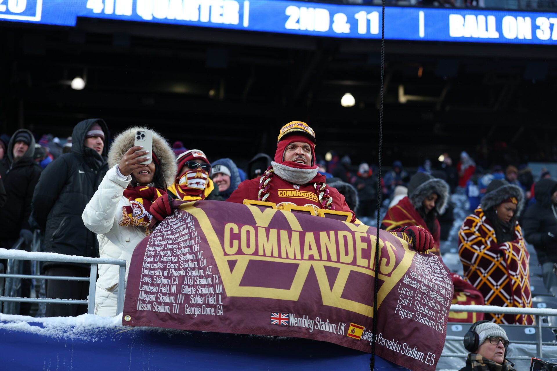 Washington Commanders fans react during the fourth quarter against the New York Giants at MetLife Stadium.