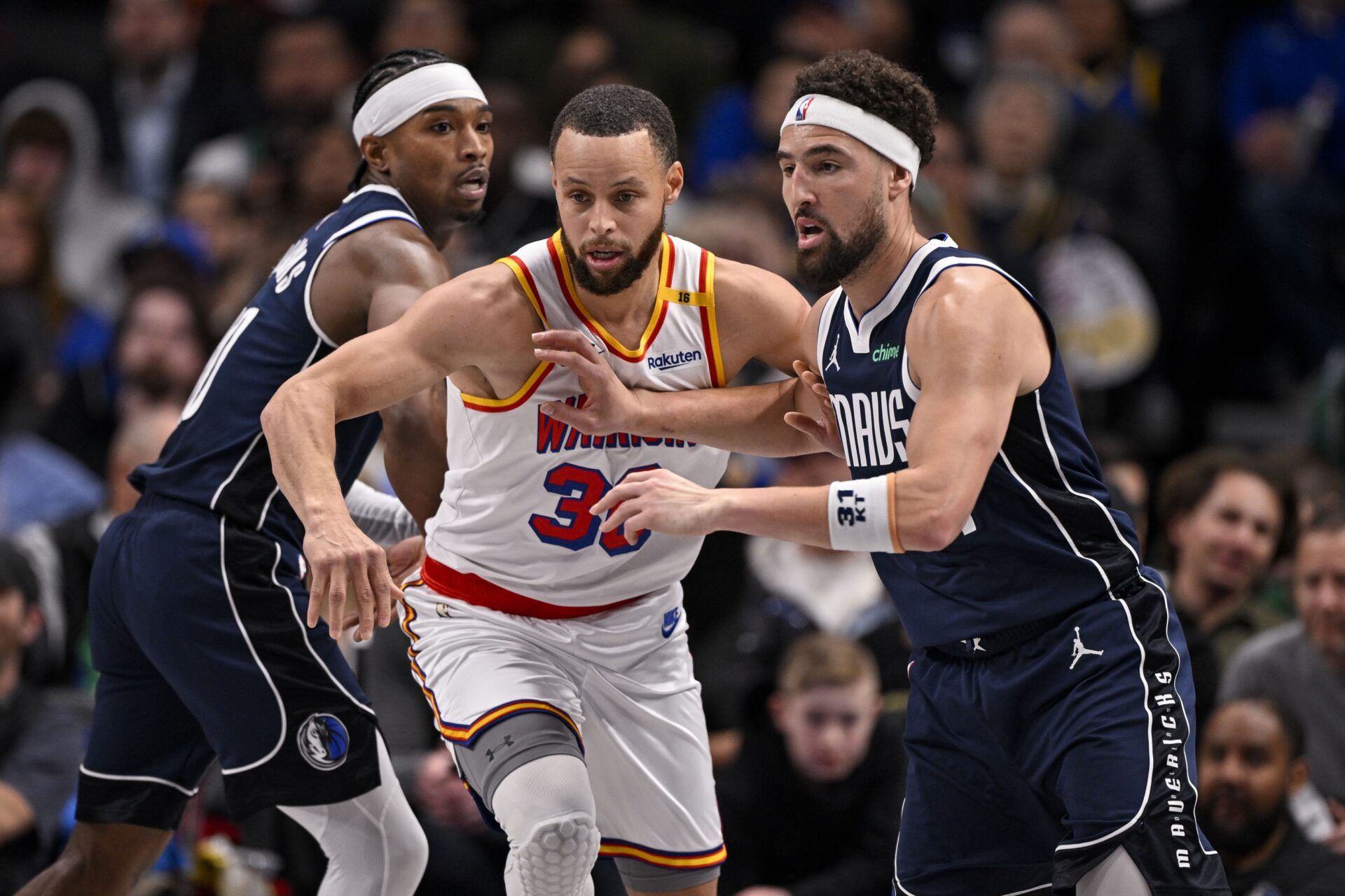 Golden State Warriors guard Stephen Curry (30) and Dallas Mavericks guard Klay Thompson (31) in action during the game between the Dallas Mavericks and the Golden State Warriors at the American Airlines Center.