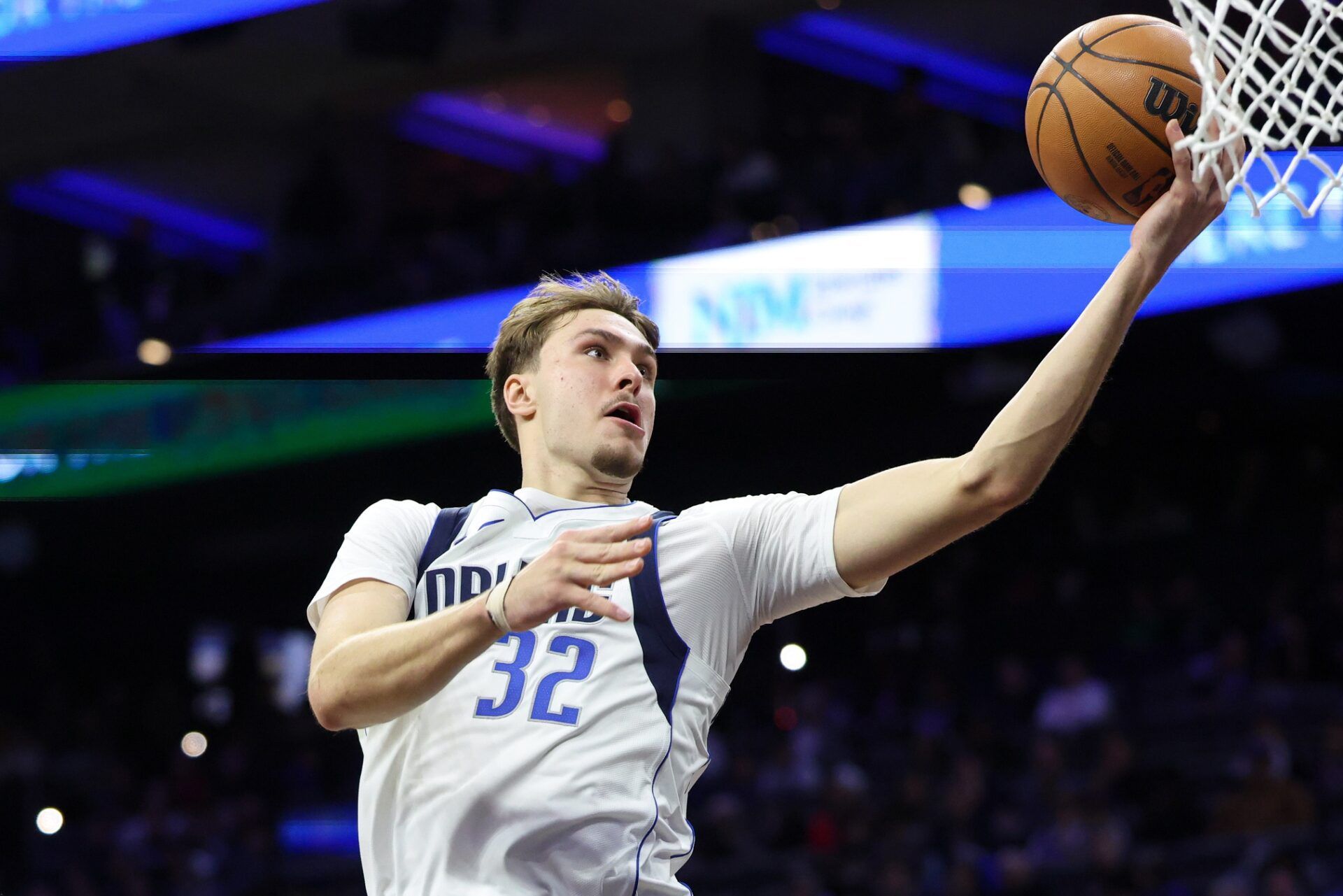 Dallas Mavericks forward Cooper Flagg (32) drives for a score against the Philadelphia 76ers during the second quarter at Xfinity Mobile Arena.
